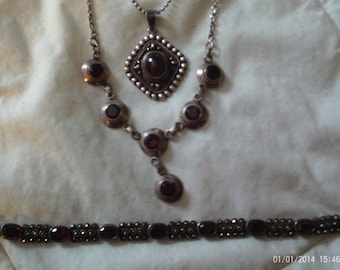 3 sterling pieces, 2 necklaces and 1 bracelet, garnet? red stones