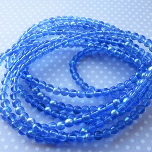 Czech Pressed Glass Round Beads, Druk, 5mm, 40 beads, Transparent Blue AB