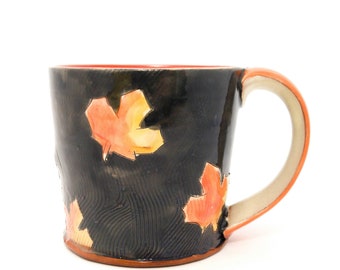 Grey maple leaf themed Earthenware mug. Wheel thrown, food safe leafy mug made by Kaitlyn Brennan