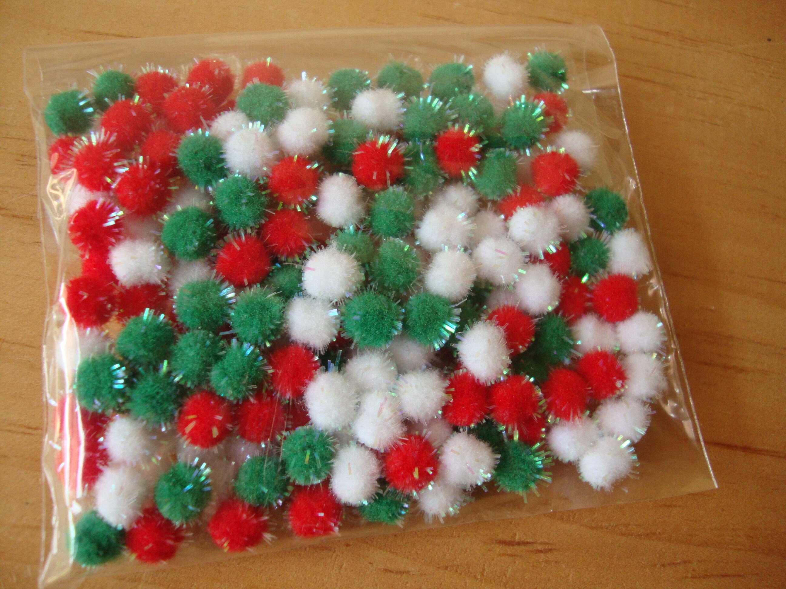 mini red pom poms mini red pom poms