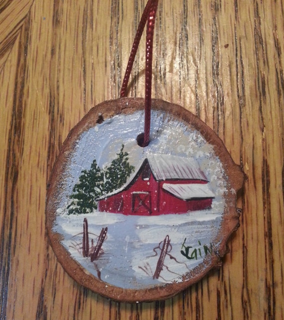 Wood slice ornament hand painted featuring an old red barn