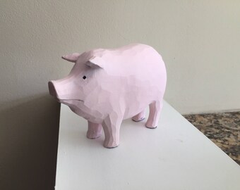 Pig statue craved wood looking light pink table top