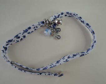 White, blue floral fabric bracelet