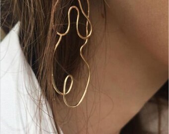 Abstract female form earrings, gold & silver