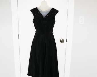 Beautiful black 1950s dress with rhinestone detail and full skirt