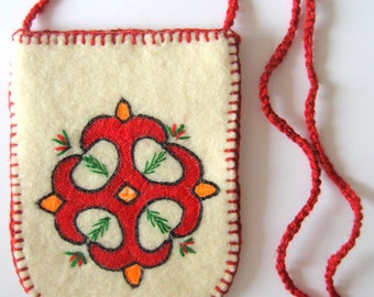 With wool embroidered felt bag.