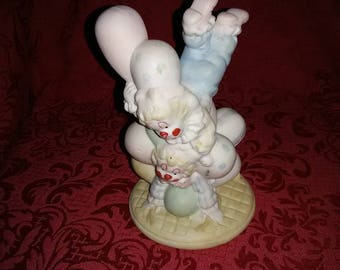 Vintage. Jumping clowns figurine.