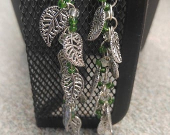 Long silver and green, leaf motif earrings