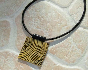 Polymer clay pendant gold with silkscreened black made entirely by hand