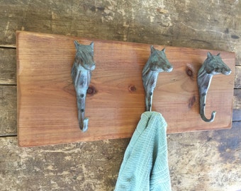 3 Cast Iron Horse Head Hooks with verde patina on Distressed Wood