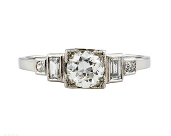 Art Deco Old European Diamond Engagement Ring with Baguettes. Circa 1930s, Platinum.