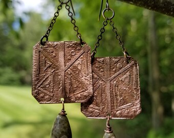Handmade etched copper earrings.