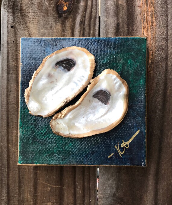 Oyster shell art on painted canvas