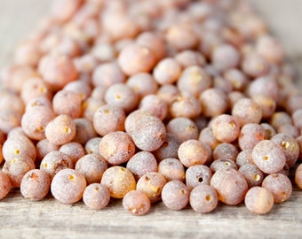 50 pcs Raw Baltic amber beads with drilled hole.