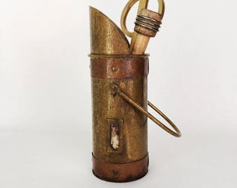 Skinny brass pitcher