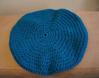 Crocheted turquoise beret woman