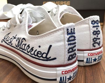 Custom Converse Wedding Bridal shoes with crystal writing on the back and white satin ribbon shoelaces.