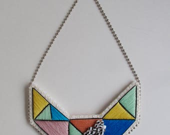 Small embroidered geometric bib necklace in beautiful multicolors of rose, yellow, blue and mint green with black and white glass beads
