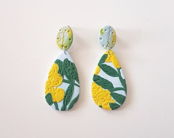 Golden wattle. Pale blue polymer clay teardrop statement earrings with golden wattle detail.
