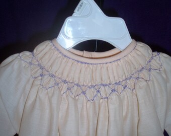Peach smocked daygown