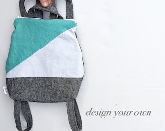 Small backpack purse in color block style. Design your own small handbag. zipper closure. adjustable straps. mini backpack for all ages.