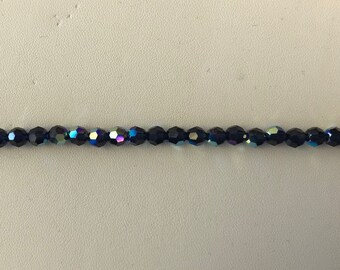 5000 Swarovski® 6mm Round - Dark Indigo AB - 12 pieces