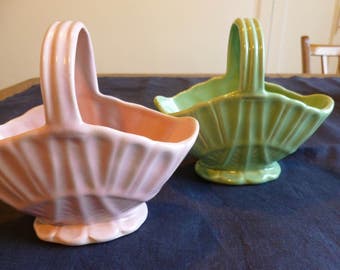Pair of Govancroft pottery baskets, pink and green