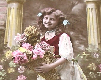 1900s French postcard, Girl with basket of flowers, RPPC real photo.