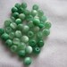 Destash (5032) - Green cats-eye round beads.