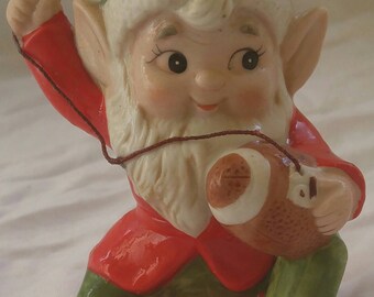Vintage Christmas elf, with a football