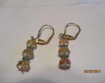 dangle earrings, gold and green crystal, gold tone lever back wires.