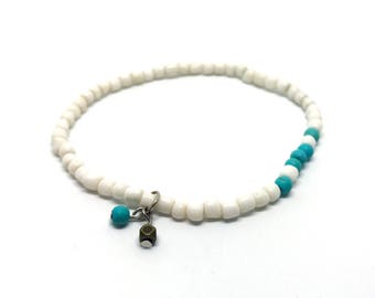 White anklet with turquoise and pendant