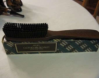 AVON Clothes Brush Valet with Shoe Horn - brown hard plastic handle; black stiff brissels; New in original box. 10 inches length.