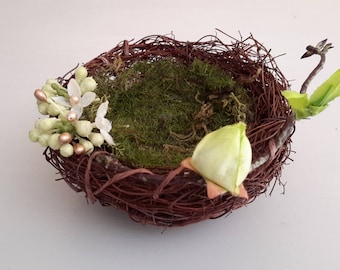 Support ring bearer nest with button and branch