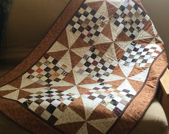 Scrappy patchwork and pinwheel quilt