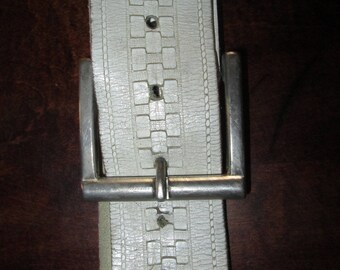 White leather belt 49 inches in length.