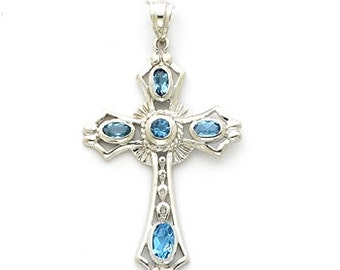Sterling Silver Cross pendant with Blue Topaz stones.