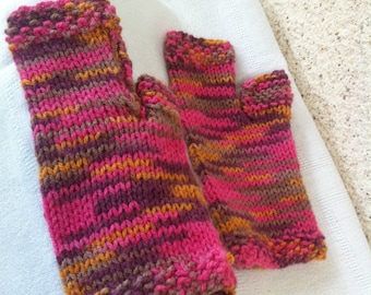 Hand knitted pink mittens