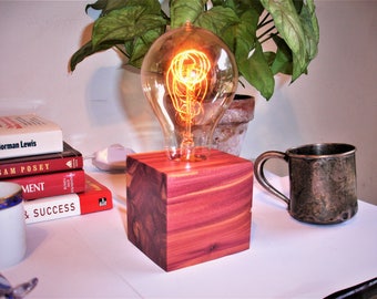 Richly colored red cedar table lamp. IN-LINE DIMMER switch. Edison old world style globe bulb.