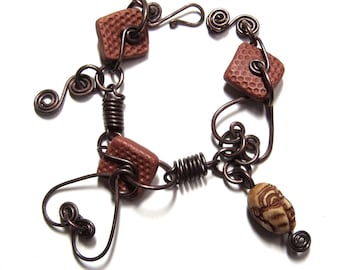 Double Heart Bracelet with Hand Formed Copper Closure, Handmade Copper Springs, Textured Square Clay Beads and Hand Carved Monk Bone Bead