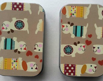 Large tin . . . Dogs and hearts.