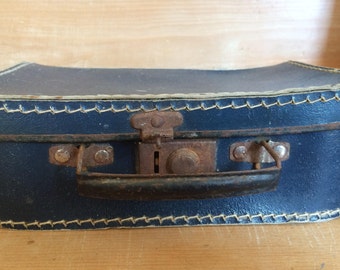 Old blue suitcase for children, with steel shoes