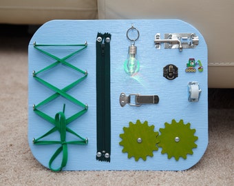 Busy Board. Activity board, early development Montessori educational toy.