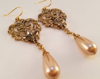 Light pink and gold dangle earrings