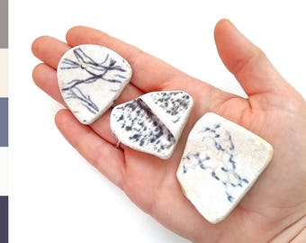 Scottish sea pottery shards, surf tumbled beach pottery pieces with flowers, washed up on the Edinburgh beach 0791