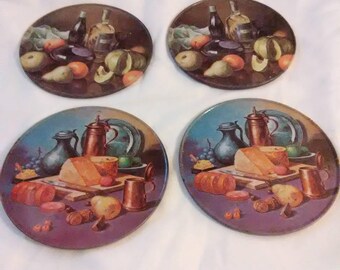 Vintage set of 4 coasters. Metal with cork bottom.