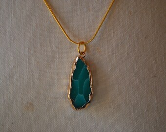 Gold and precious stone necklace