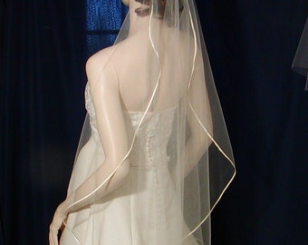 Satin Ribbon trimmed cascading style bridal veil available in Elbow to Royal length too !
