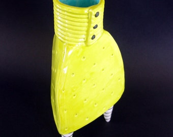Dr Seuss whimsical vase with 3 black & white striped legs