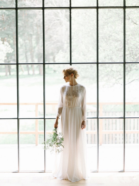Highnecked milk dress with lavender lace decoration